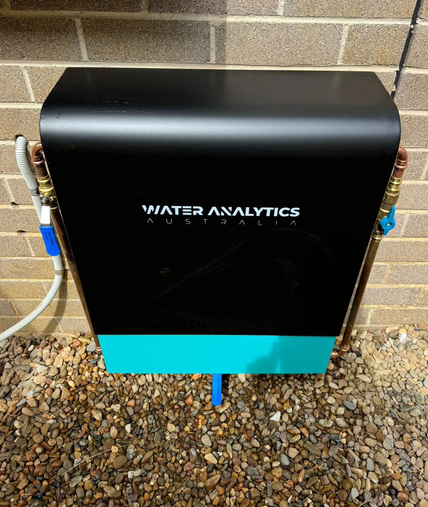 Black Water Analytics whole house filter with aqua blue panel installed