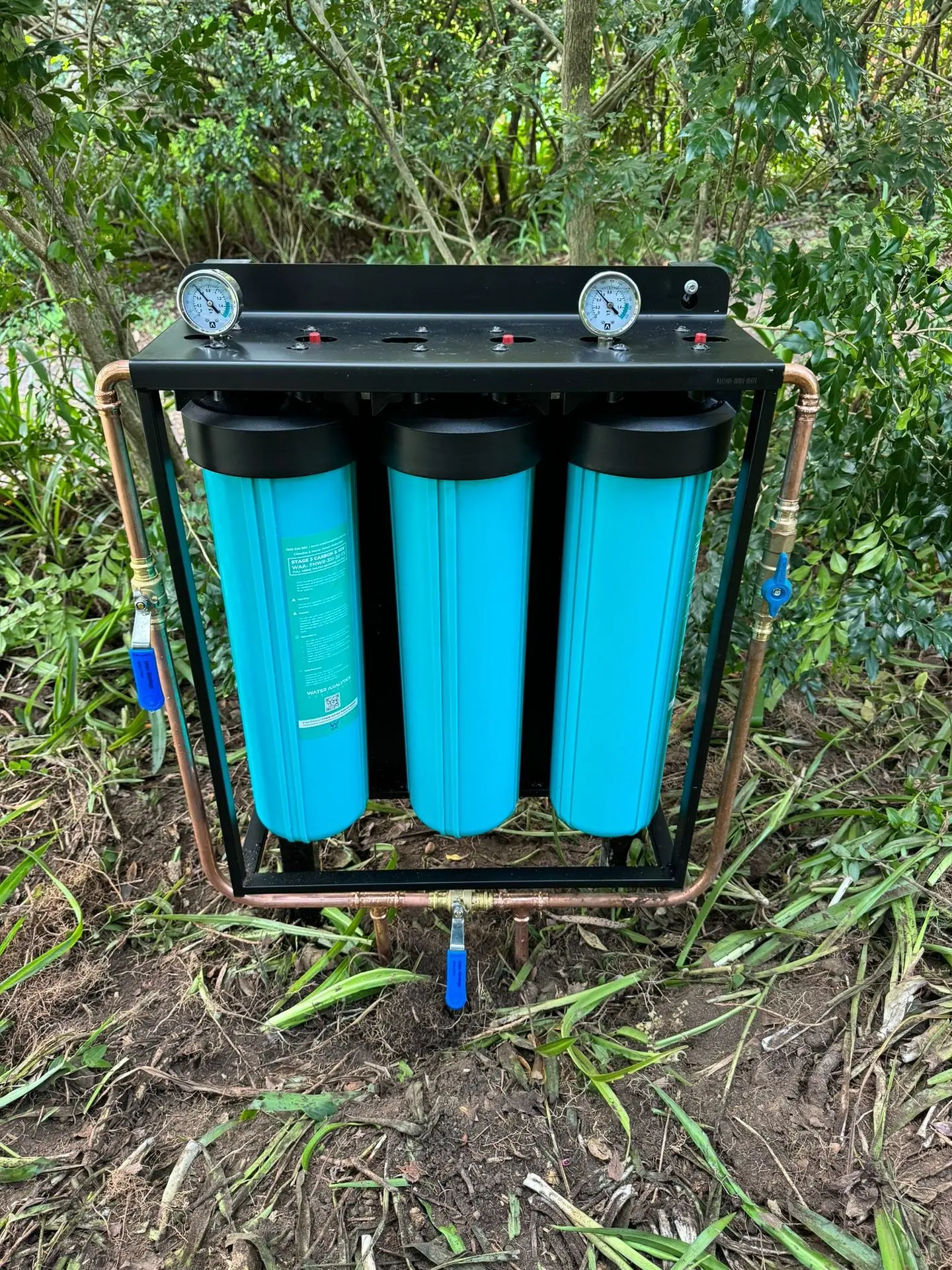Triple-stage whole house water filtration system with pressure gauges